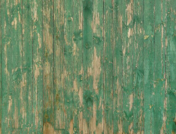 Weathered planks set in vertical fashion with scratches and fading paint.